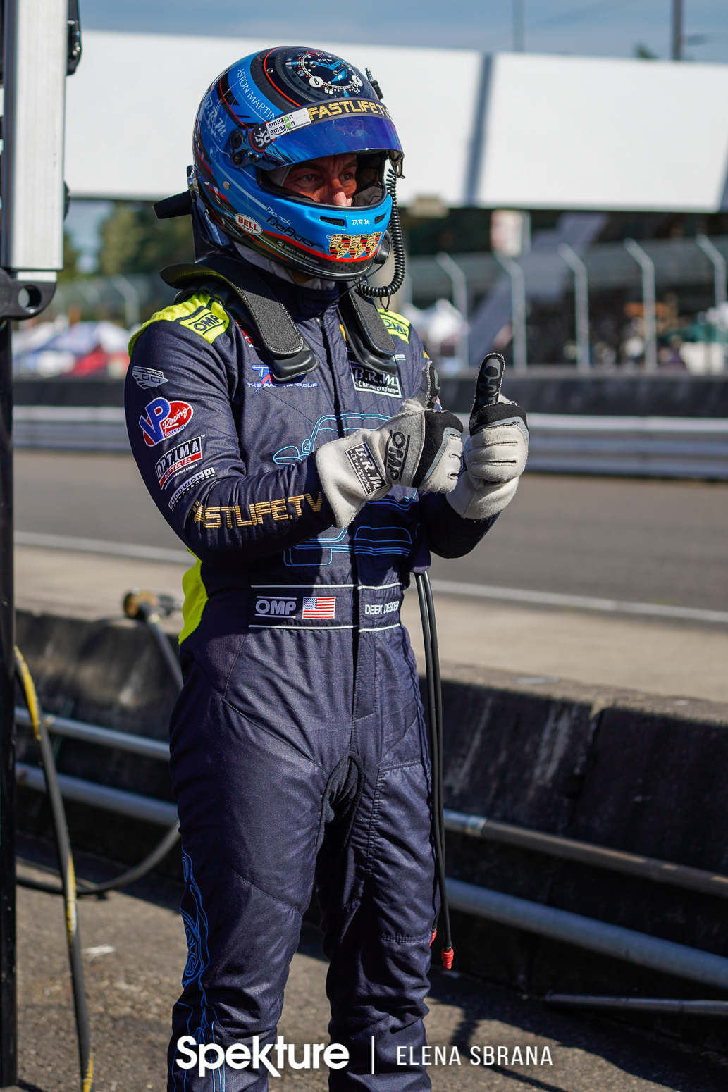 Earchphoto - Derek in pit lane ready for driver change at PIR. 