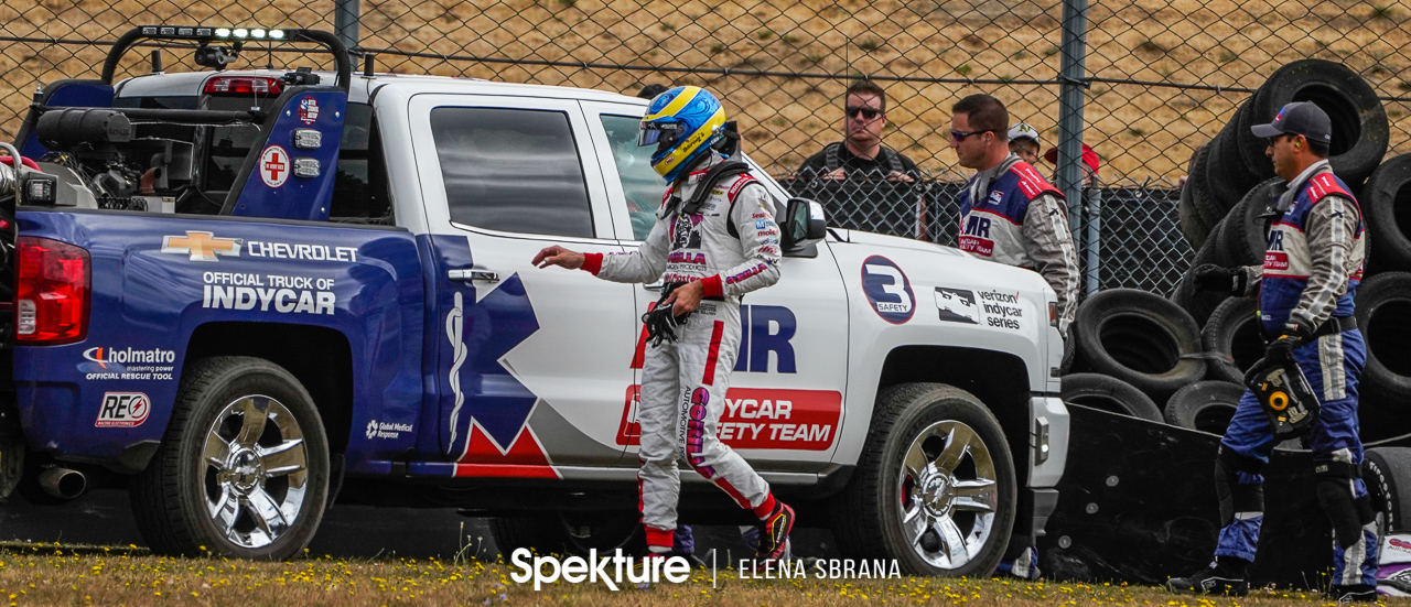 Earchphoto - Sebastien Bourdais with the AMR track safety team after hitting the tire wall off turn 11 at the Grand Prix of Portland. Verizon Indycar Series. 