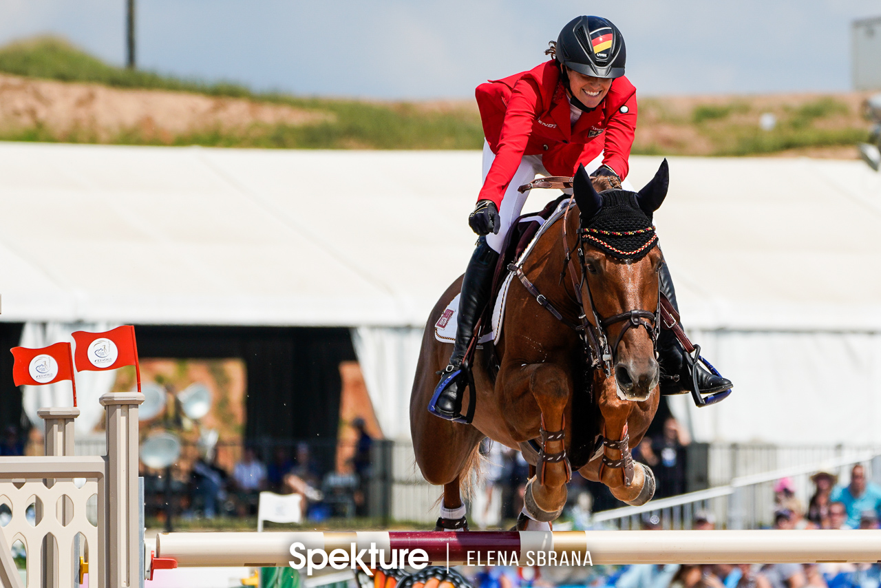 Earchphoto - Simone Blum celebrates her third clear round and the gold medal at the 2018 World Equestrian Games in Tryon NC