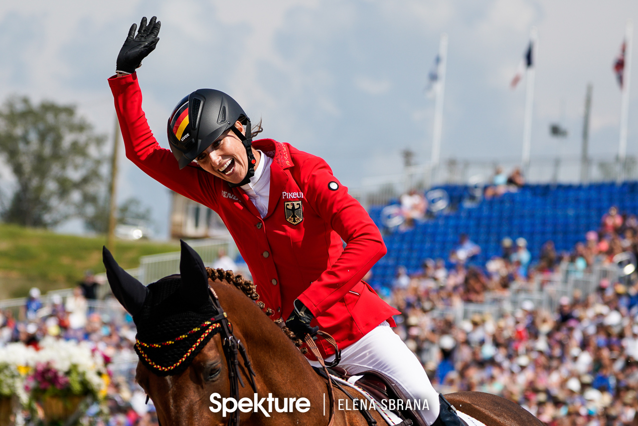 Earchphoto - Simone Blum celebrates her third clear round and the gold medal at the 2018 World Equestrian Games in Tryon NC