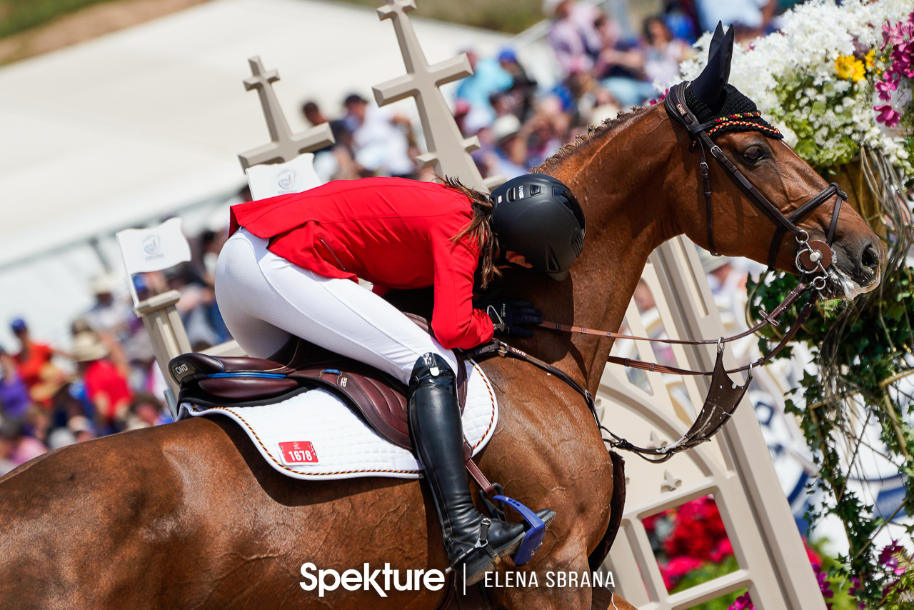 Earchphoto - Simone Blum thanks her mare DSP Alice after the winning round at the 2018 World Equestrian Games in Tryon NC