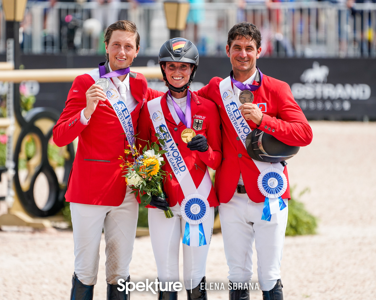 Earchphoto - Simone Blum, Martin Fuchs, and Steve Guerdat on the individual show jumping podium at the 2018 World Equestrian Games in Tryon NC