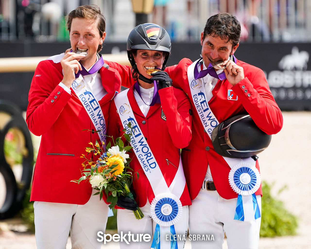 Earchphoto - Simone Blum, Martin Fuchs, and Steve Guerdat on the individual show jumping podium at the 2018 World Equestrian Games in Tryon NC