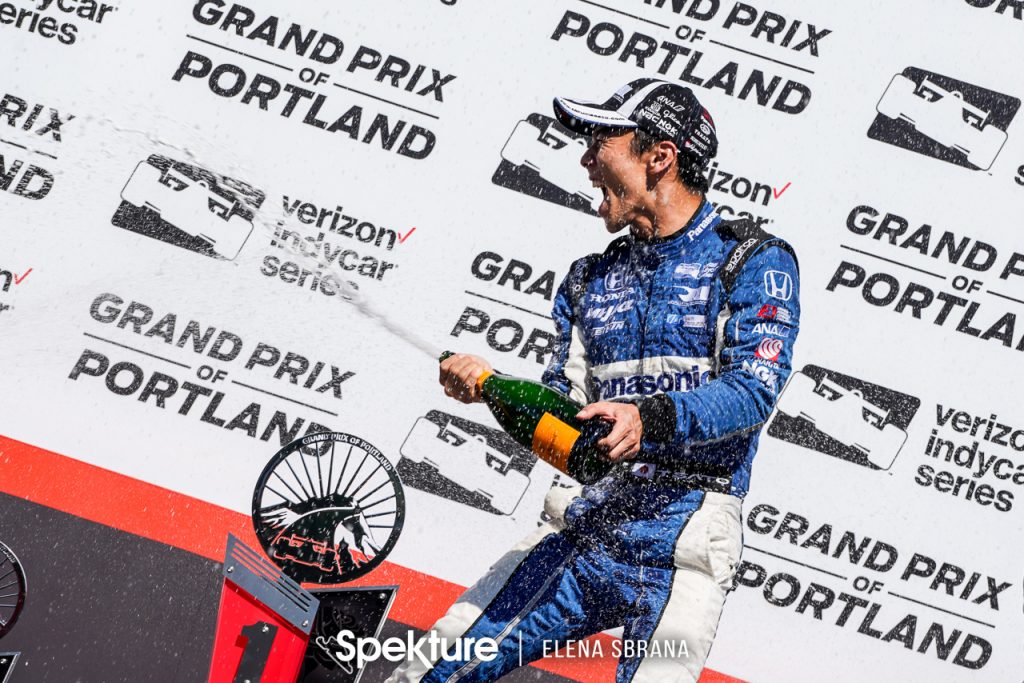 Earchphoto - Takuma Sato celebrates on the podium at the Grand Prix of Portland